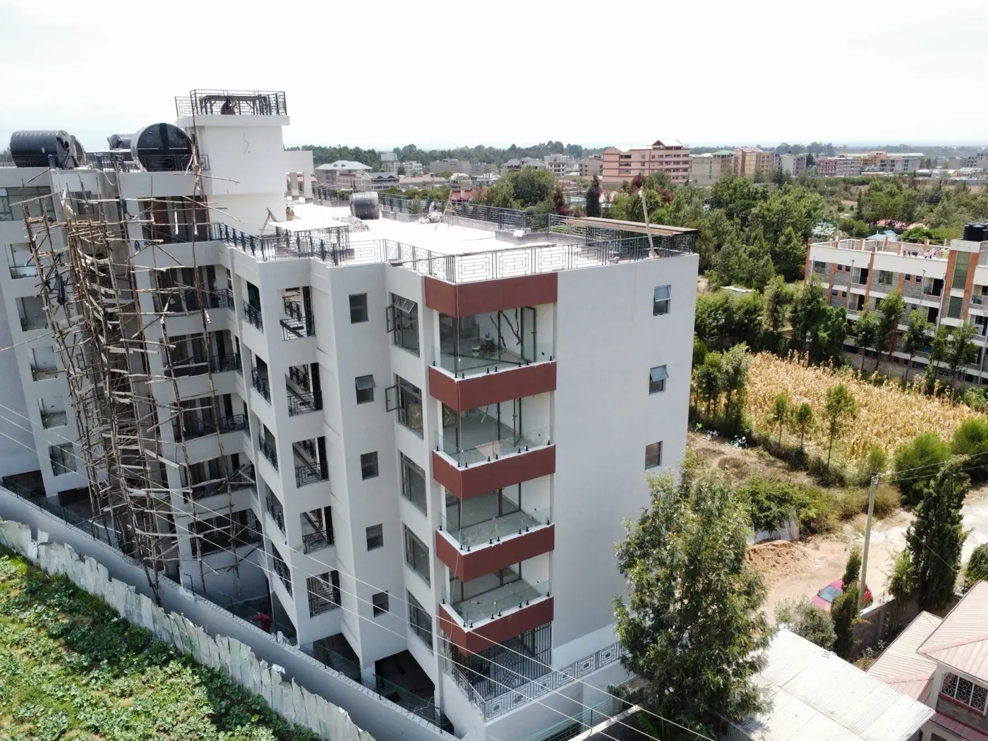 Side elevation of the 45-unit apartment development in Nanyuki showing balconies, glazing and ongoing finishing work.
